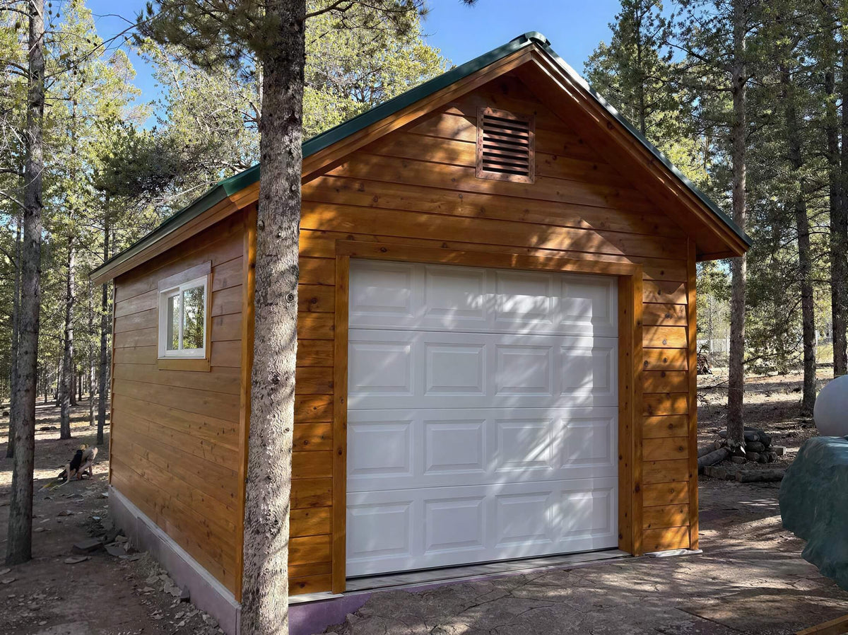 Customer built 12x16 gable shed using shedking's 12'x16' gable with roll up shed door.